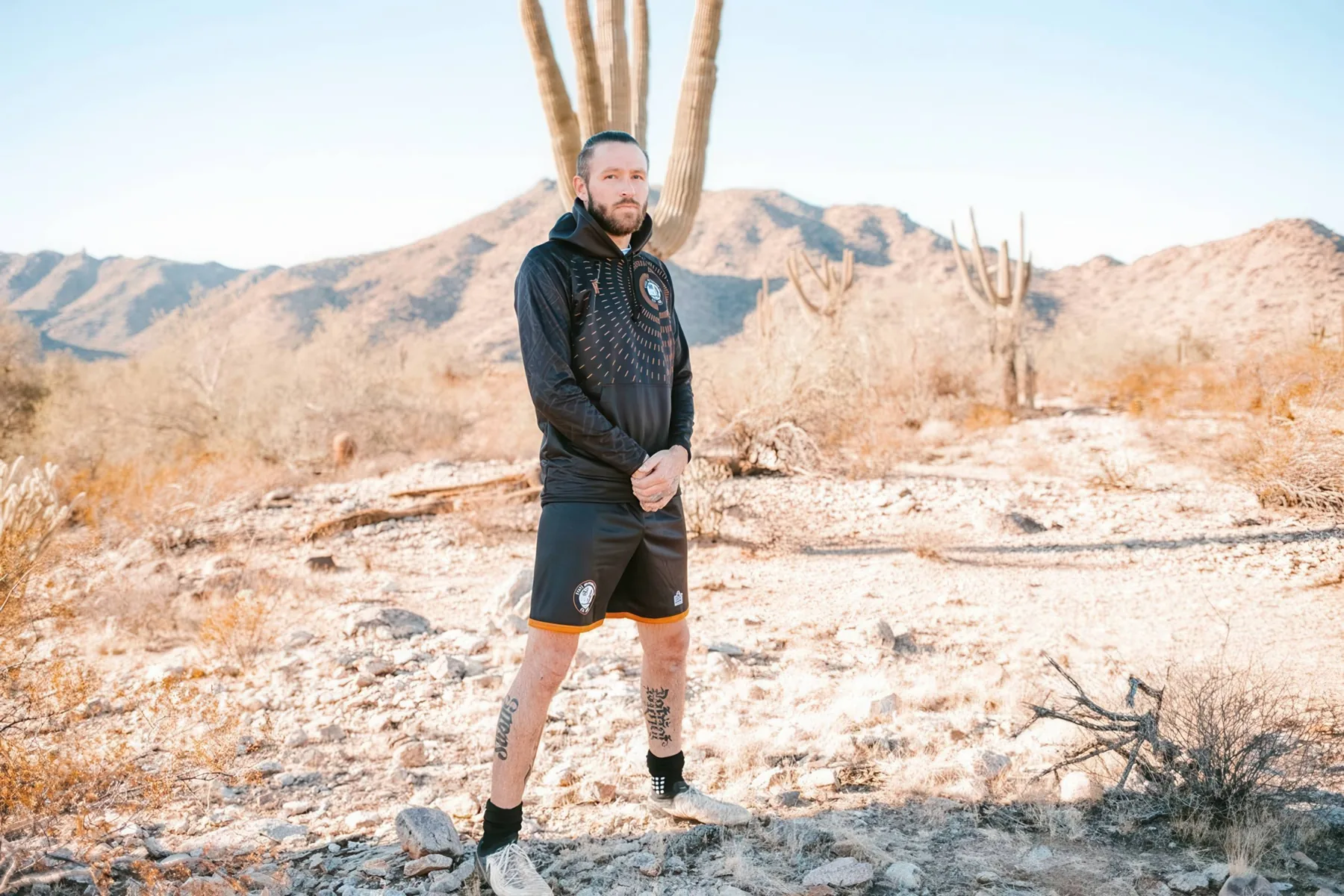 State 48 player wearing black outerwear in the Arizona desert